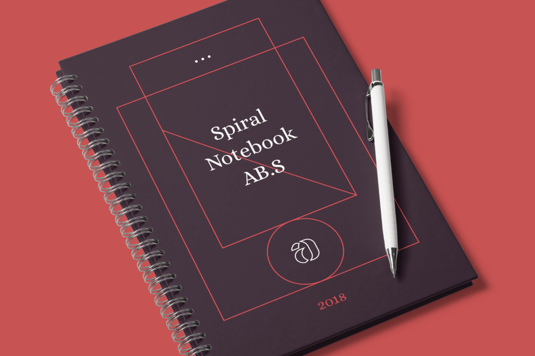 Spiral notebook mockup standing on a transparent surface. Spiral Notebook Mockup Scene